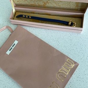 Brand new AUTHENTIC Miu Miu Prada leather bracelet in navy with gold hardware.